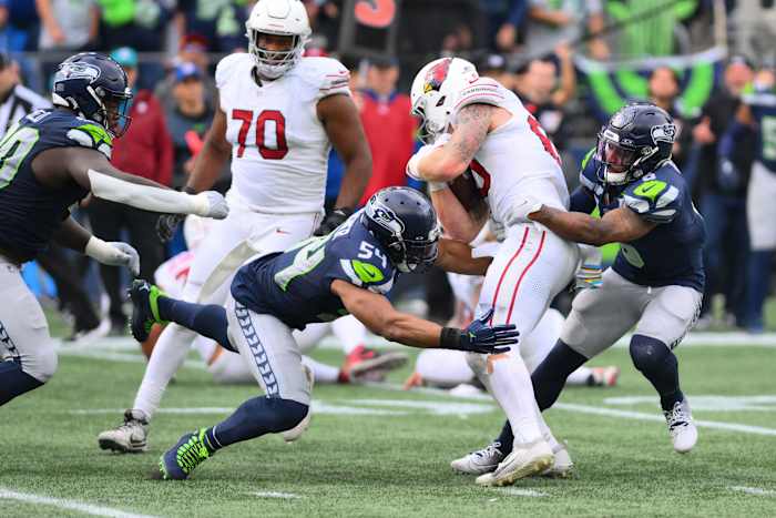 Oct 22, 2023; Seattle, Washington, USA; Seattle Seahawks linebacker Bobby Wagner (54) and Seattle Seahawks safety Quandre Diggs (6) tackle Arizona Cardinals tight end Trey McBride (85) during the second half at Lumen Field.